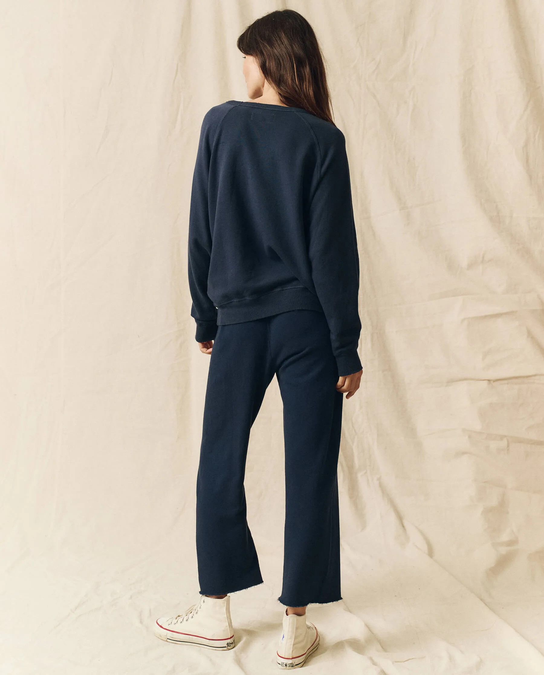 The Wide Leg Cropped Sweatpant. -- True Navy